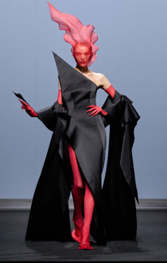 Robert Wun couture dress with red floating veil. 