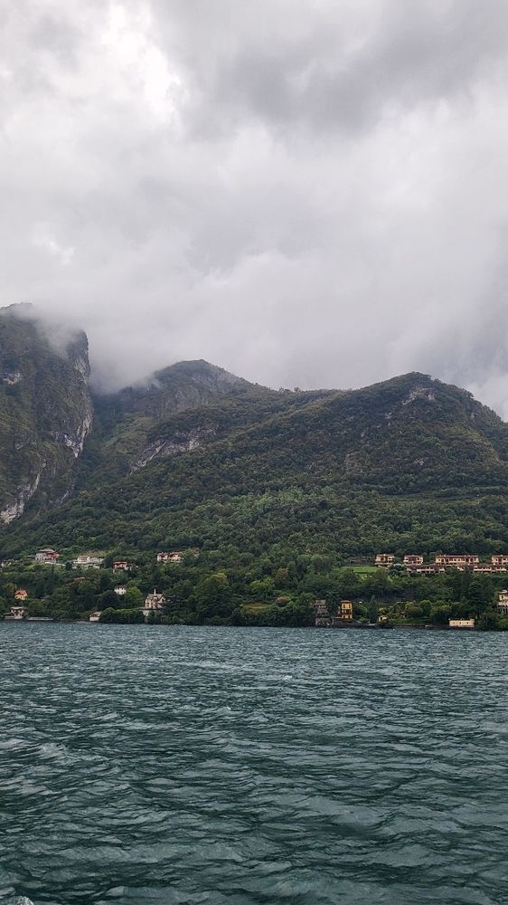 cloudy mountain picture of one of lake como towns