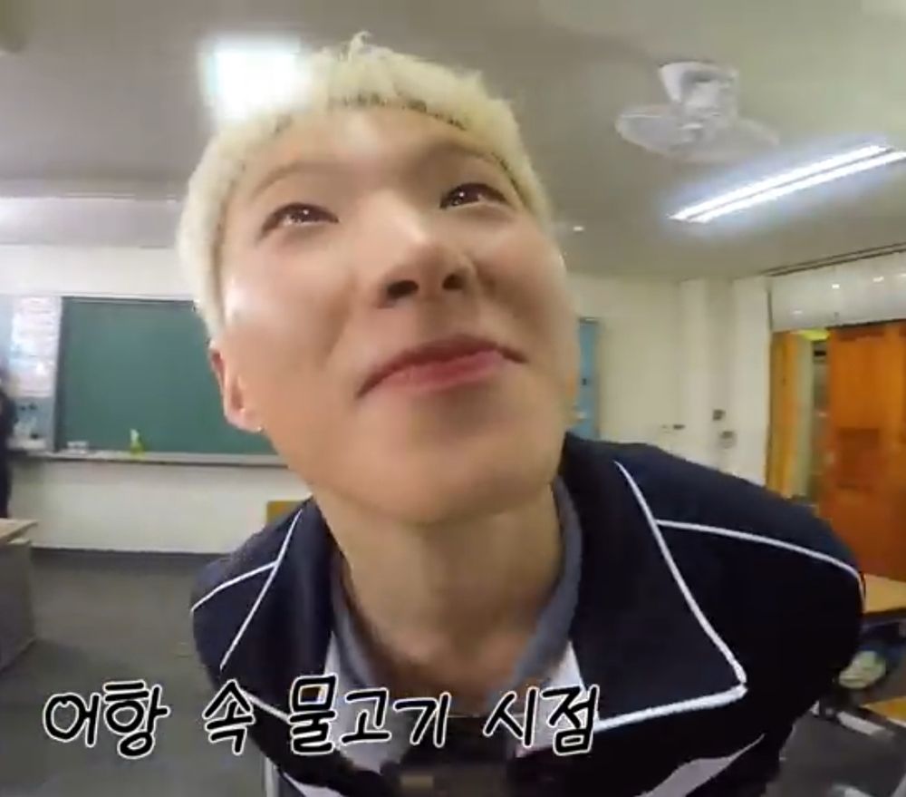 Up close pic of hoshi's face looking upwards to make eye contact with the person he's facing