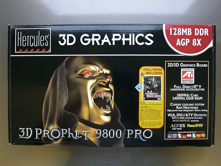 Box art: Hercules 3D Graphics 128MB DDR AGP 8X 3D Prophet 9800 PRO with a crazy ass golden vampire looking menacing with huge pointy teeth staring like at an angle away from the front. Full game Tom Clancy's Rainbow Six Raven Shield included!