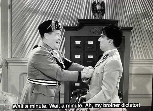 From "The Great Dictator": Napaloni greets Hynkel, saying, "Wait a minute. Wait a minute. Ah, my brother dictator!"
