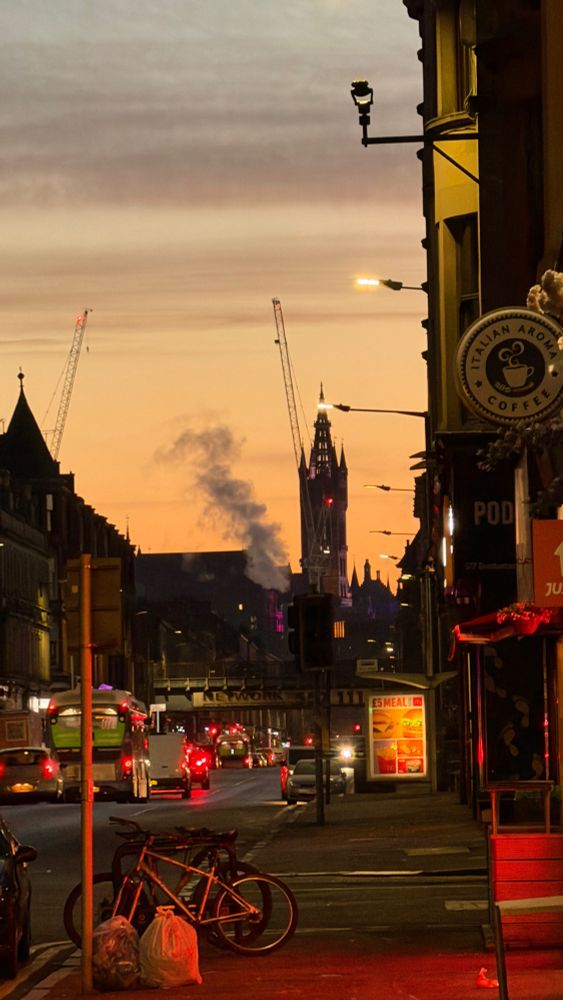 A city scene. The distinctive Glasgow university tower visible in the background. 