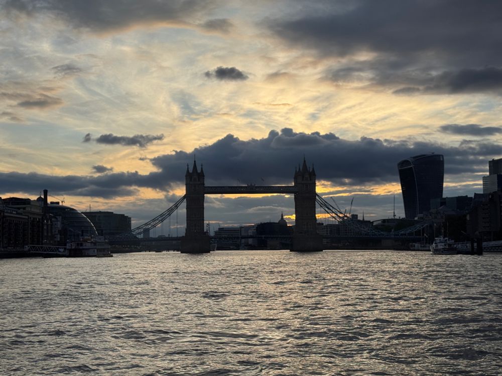 Tower bridge at sunset with dark clouds. 