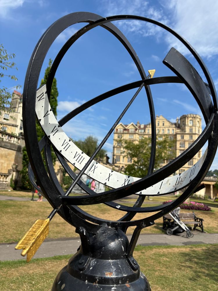 A sundial made out of an armillary sphere, with an arrow as the gnomon
