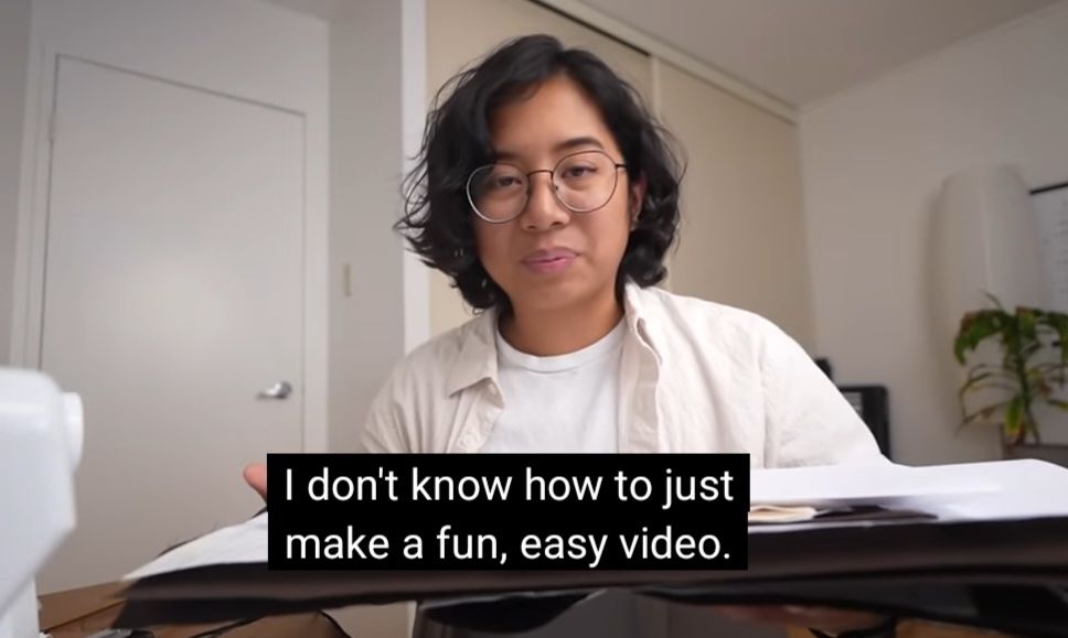 Sabrina holding hear materials to make a pair of trousers saying: "I don't know how to just make a fun, easy video."