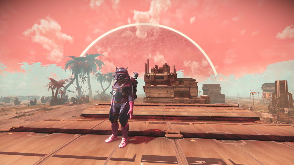 My player character standing on top of a roof of one of the settlement buildings. This is what the planet looks like at midday.
