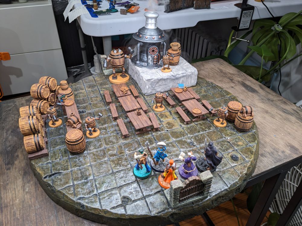 Miniatures on a board depicting a bar scene.