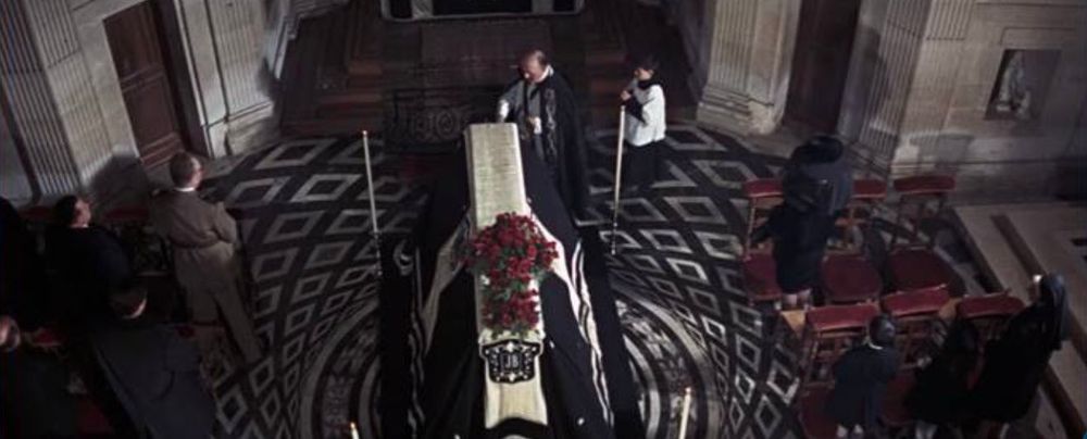 A funeral with a casket 