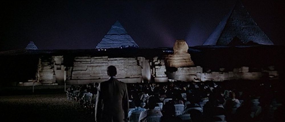 A man at a presentation in front of the pyramids in Egypt 