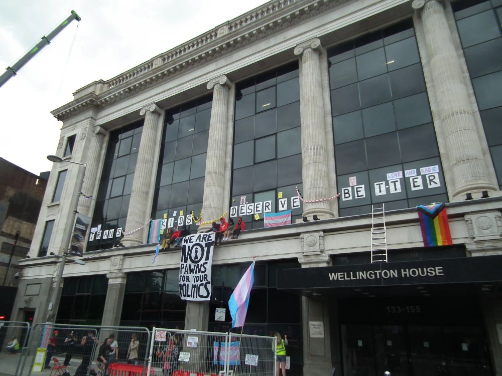 Trans teens occupy ledge at NHS England headquarters