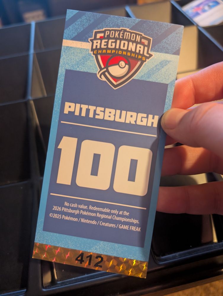 A blue ticket reading Pokémon Regional Championships, Pittsburgh, 100 [points], #412. 