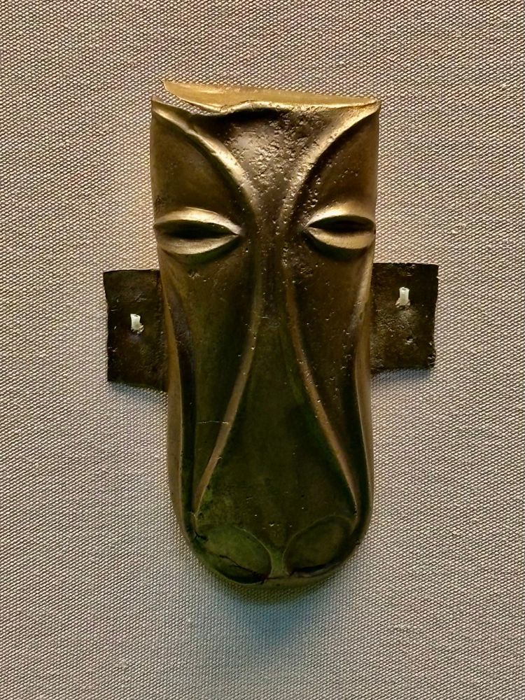 Iron Age bronze mount of stylised horses head.
