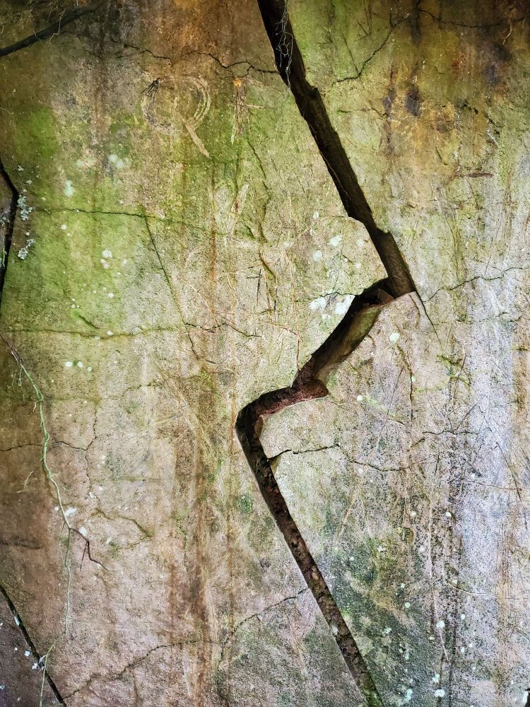 A lightning-shaped schism in a vertical rock face.