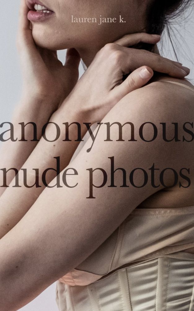 The cover of a book - soft cream and pink tones, a woman in profile, wearing a corset and bra - the image is close cropped so all one can see is her hand on her shoulder, the bone of the corset and the side of the bra and her breast, the bottom her jaw, mouth slightly parted. The title of the book is "Anonymous Nude Photos"