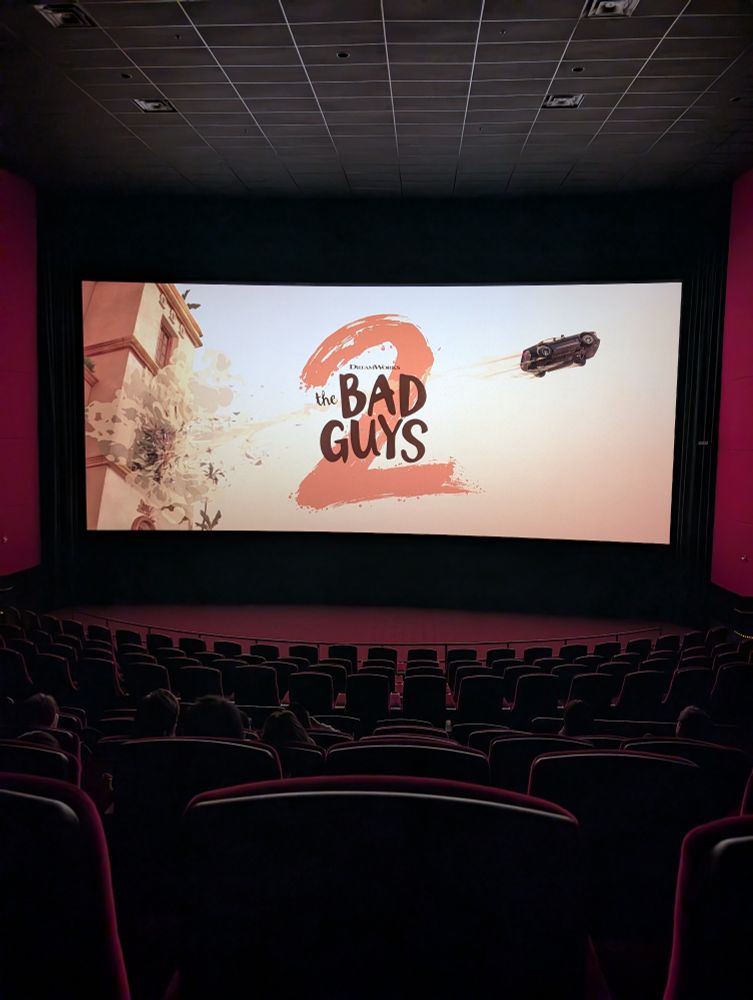 Screen showing the title text The Bad Guys 2, with a car in the air off to the right