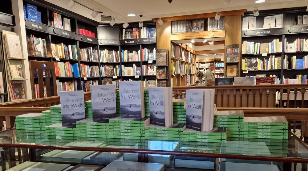 A quite impressive pile of copies of BLURRED by Iris Wolff displayed on a table in Hatchards 