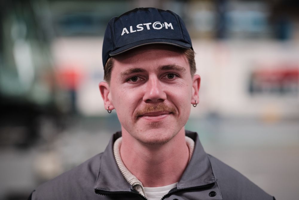 Portrait of an Alstom plant employee on the TGV production line wearing an Alstom cap, in Aytre, France on March 14, 2025. Adrien Auzanneau / Hans Lucas #hanslucas