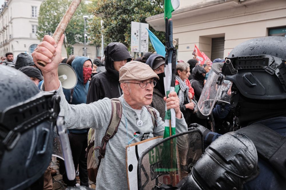 nteraction in between a demonstrator with the flag of the Palestine Solidarity Association wearing pins and a Gaza silence we kill sign facing the riot police CRS in Nantes, France on September 21, 2024. In response to a call from left-wing political parties and youth organizations, a rally against the Barnier government was joined by a demonstration for an end to the Palestinian conflict today being the International Day of Peace. Adrien Auzanneau / Hans Lucas #hanslucas