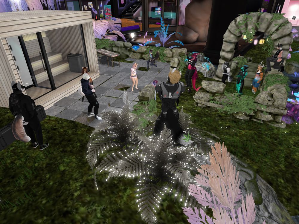 Bunch of avatars dancing on a party in the outside of Paradise Lounge, furry hangout club in Second Life. 