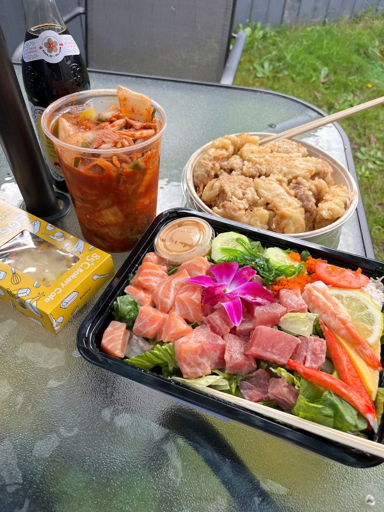 Sashimi and fried calamari. Some kimchi. Egg tart in a box