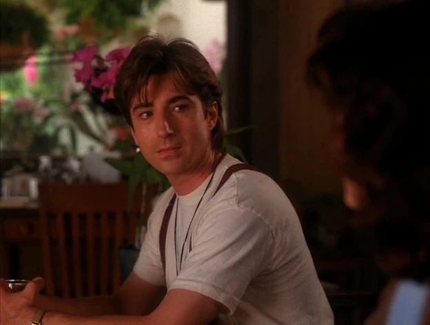 Harold sitting with his orchids, looking at Donna.

Is he... you know?