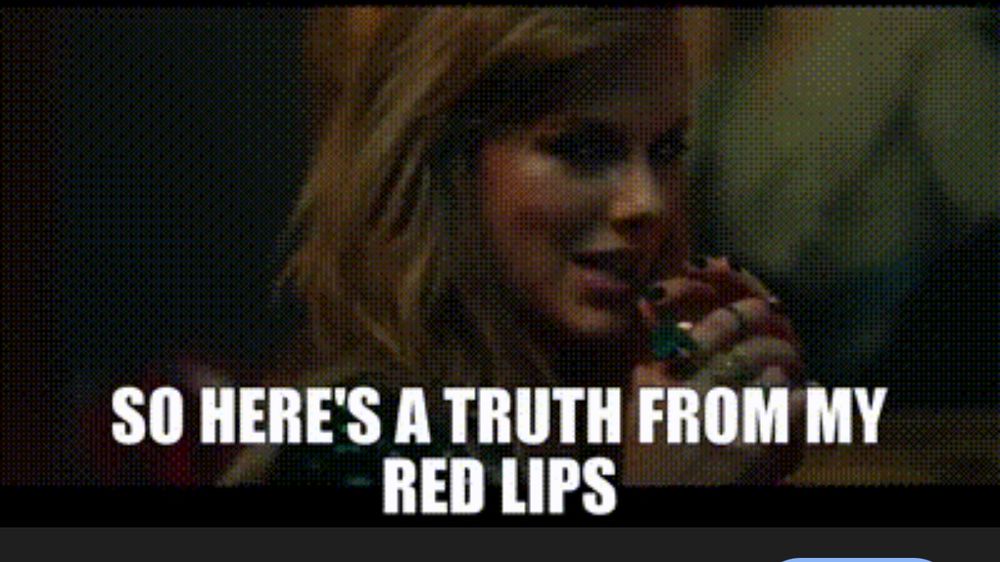 End Game music video with Tayliar saying “here’s the truth from my red lips,” while wearing a pink lipstick. With a wink straight into cam
