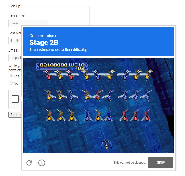 Cropped screenshot of an example webpage with a basic sign-up form, including fields for first and last names, mail, and a binary yes-no toggle for some newsletter garbage. The ReCAPTCHA below the form, however, has been edited: its proof requirement states that the user must get "a no-miss on Stage 2B" (in Radiant Silvergun) with a small subtitle that states "[this] instance is set to Easy difficulty." Below that, a still shot of the beginning of Stage 2B, with three rows of differently-colored enemy ships (in reds, yellows, and blues). The skip button has been greyed out with a small bit of text next to it that ominously states: "This cannot be skipped."