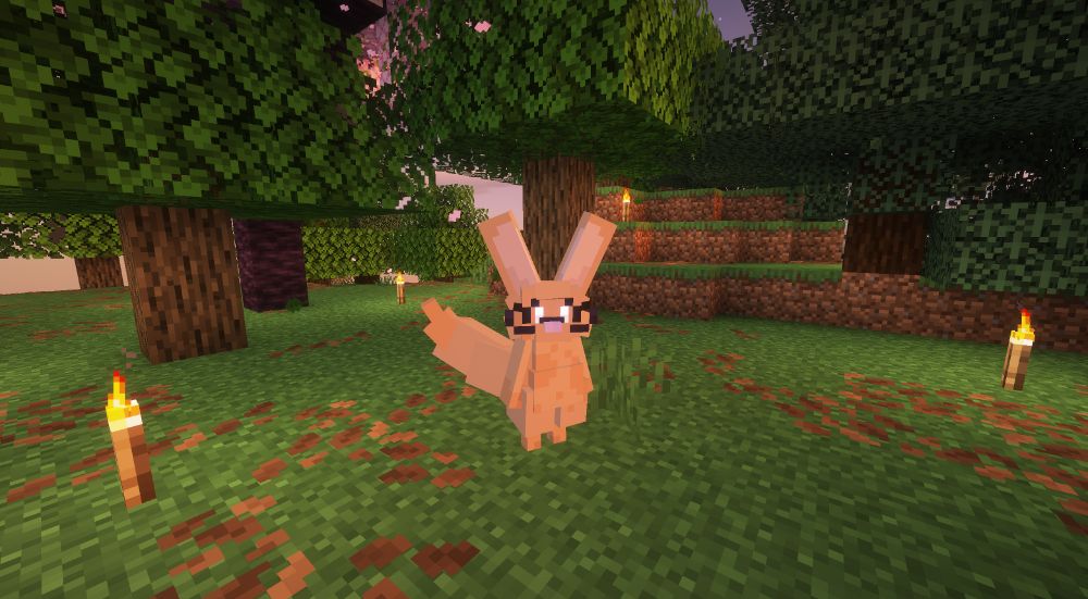 minecraft periwinkle in a forest next to some torches