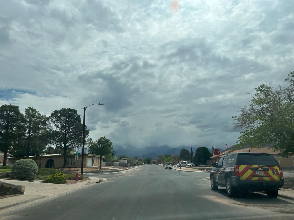 Sky full of clouds gobbling down on mountains 