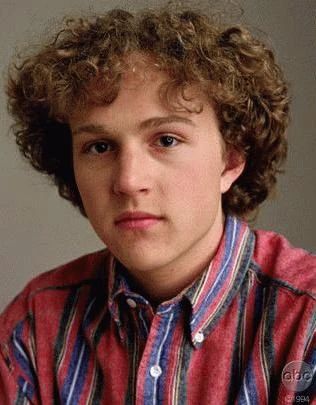 Brian Krakow from My So-Called Life, wearing a red striped shirt and looking straight to camera with a serious expression. Could almost be a yearbook photo?