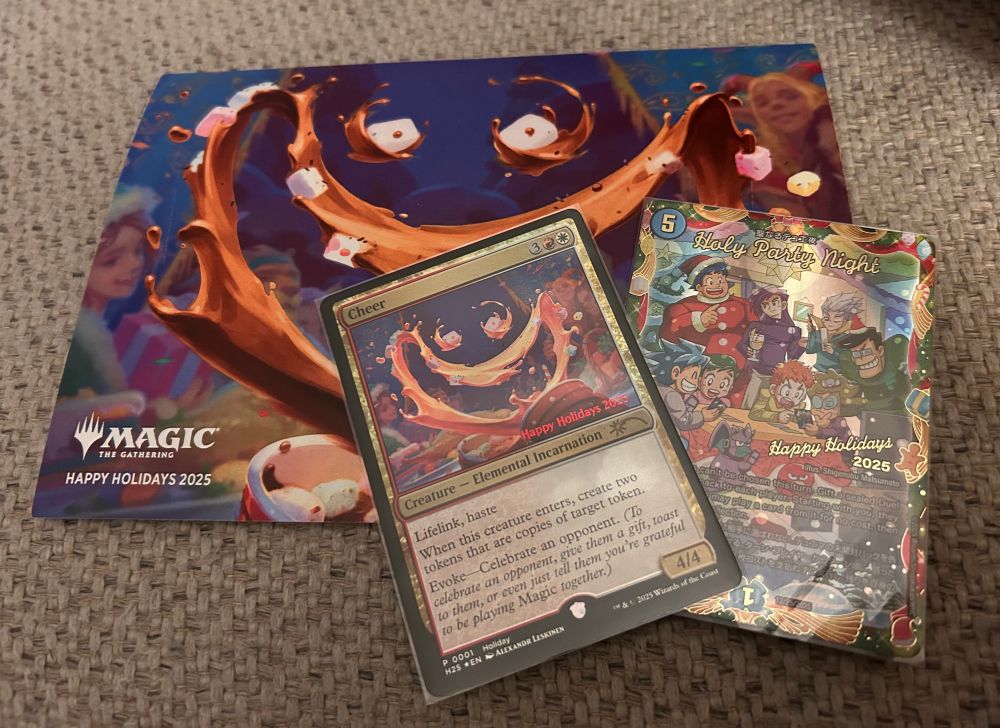 A holiday card sent from wizards of the coast with a promo card named “cheer” and a duel masters card named “holy party night” 