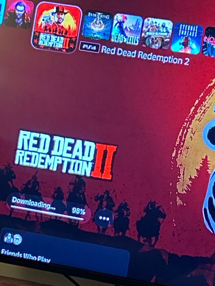 Same photo only the download bar is at 98% for red dead redemption 2 