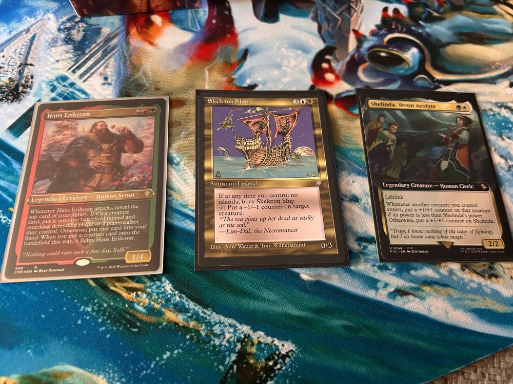 Three magic the gathering cards: Hans Eriksson, skeleton ship, and shelinda, yevon acolyte 