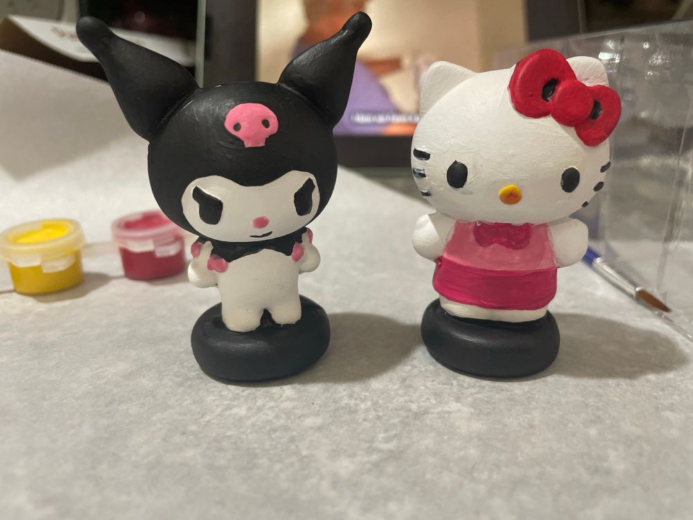Painted Kuromi and hello kitty clay figures 