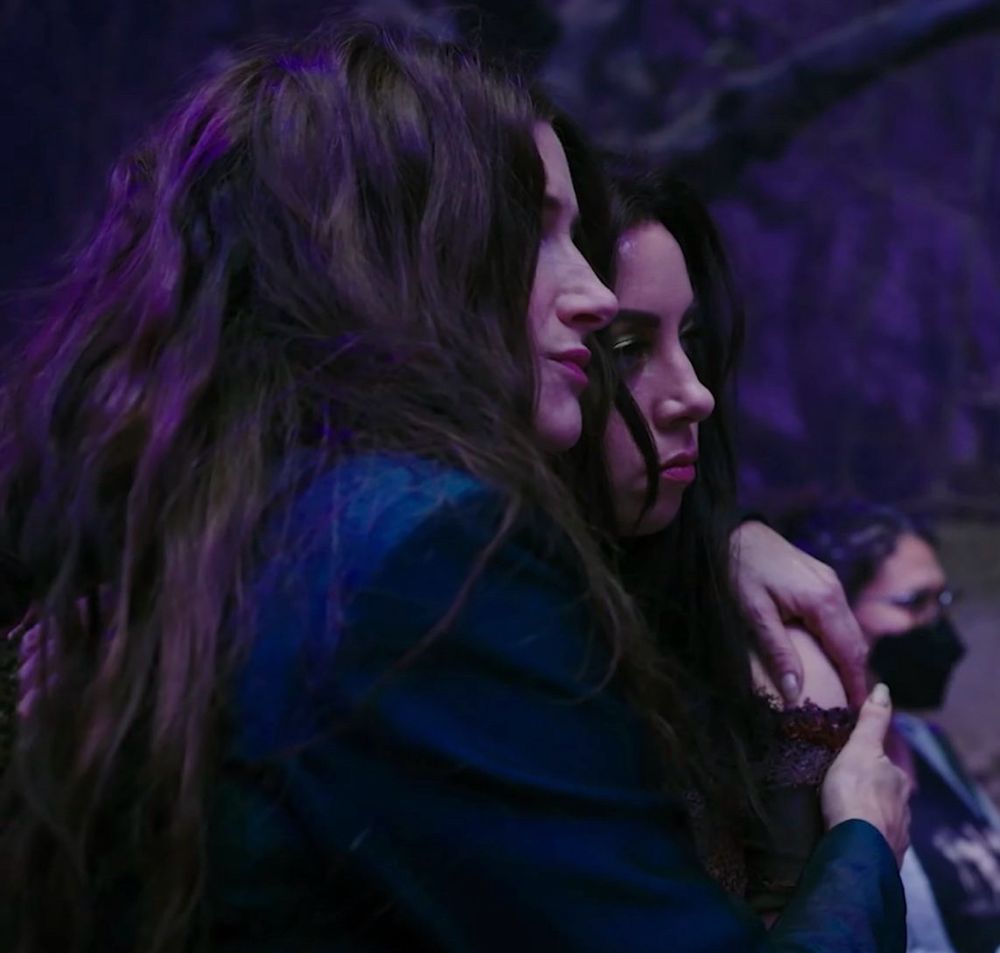 A picture of Kathryn Hahn as Agatha holding Aubrey Plaza as Rio 