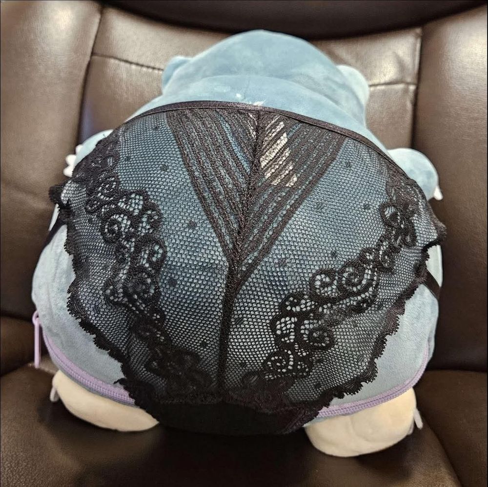 A snorlaz presenting the transparent backside of a pair of lacy black panties and their dumptruck ass