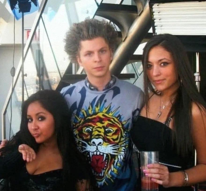 Michael Cera hanging out with the cast of Jersey Shore after being given a makeover to look "more tough"