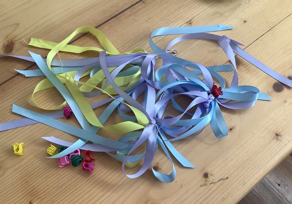 hair clips and a tangle of blue yellow and mauve hair ribbons