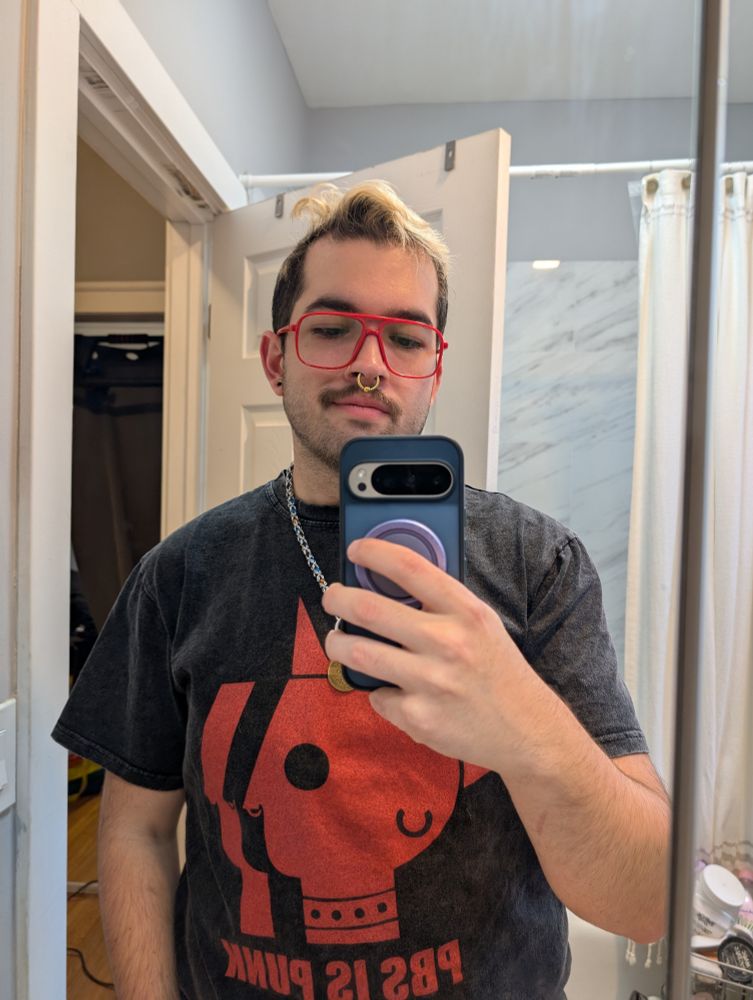 Bathroom mirror selfie of me in my red aviator glasses. 