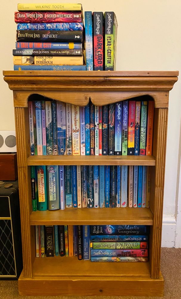 A photo of a small bookcase that is entirely filled with books by Diana Wynne Jones