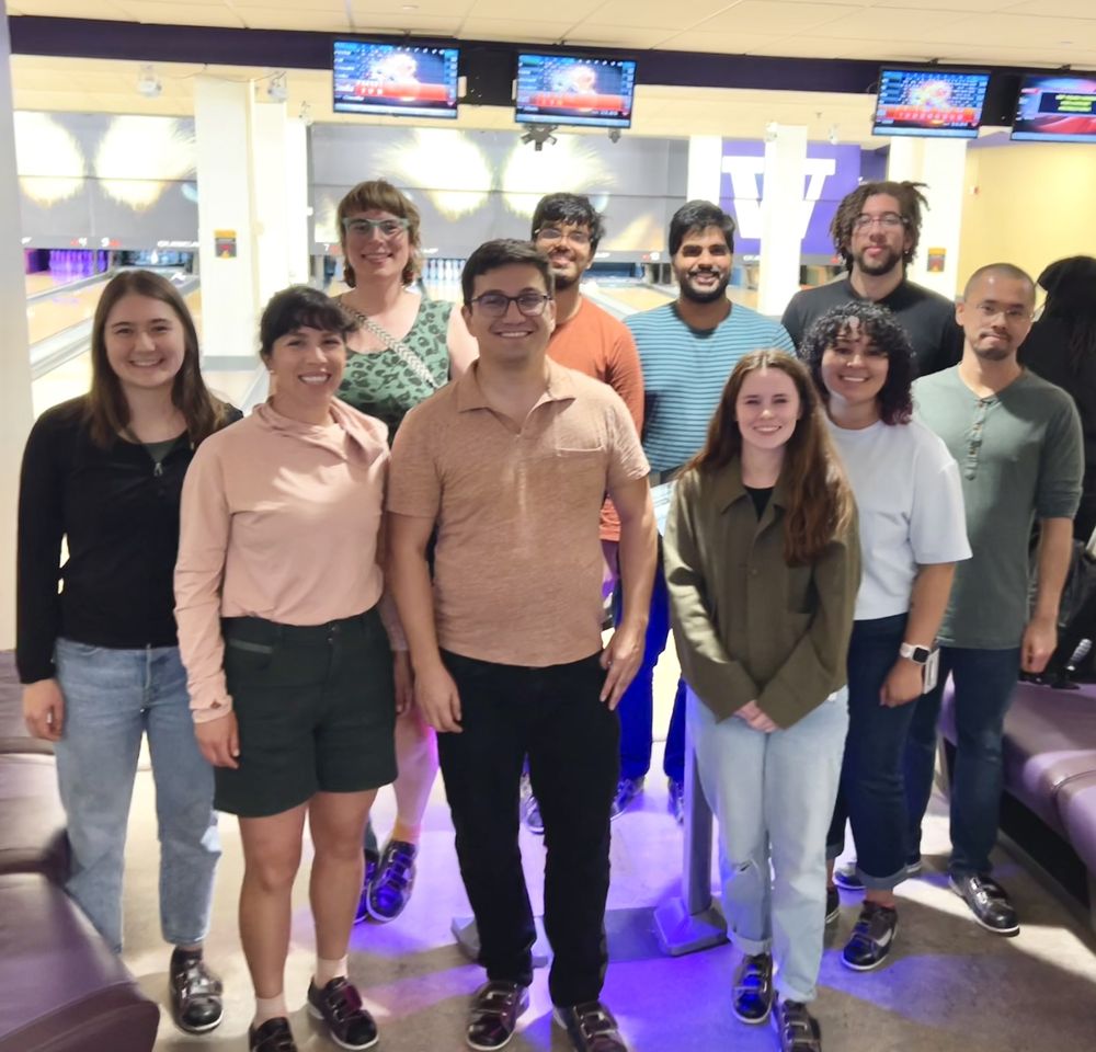 Members of the Vasquez and Akamatsu Lab smile in front of bowling lanes.