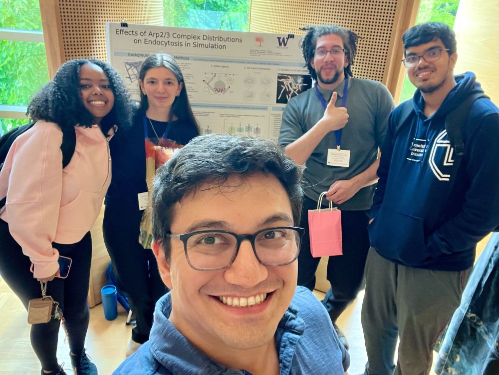 Hanna, Emma, Matt, Ben, and Aadarsh in front of a poster titled "Effects of Arp2/3 Complex Distributions of Endocytosis in Simulation