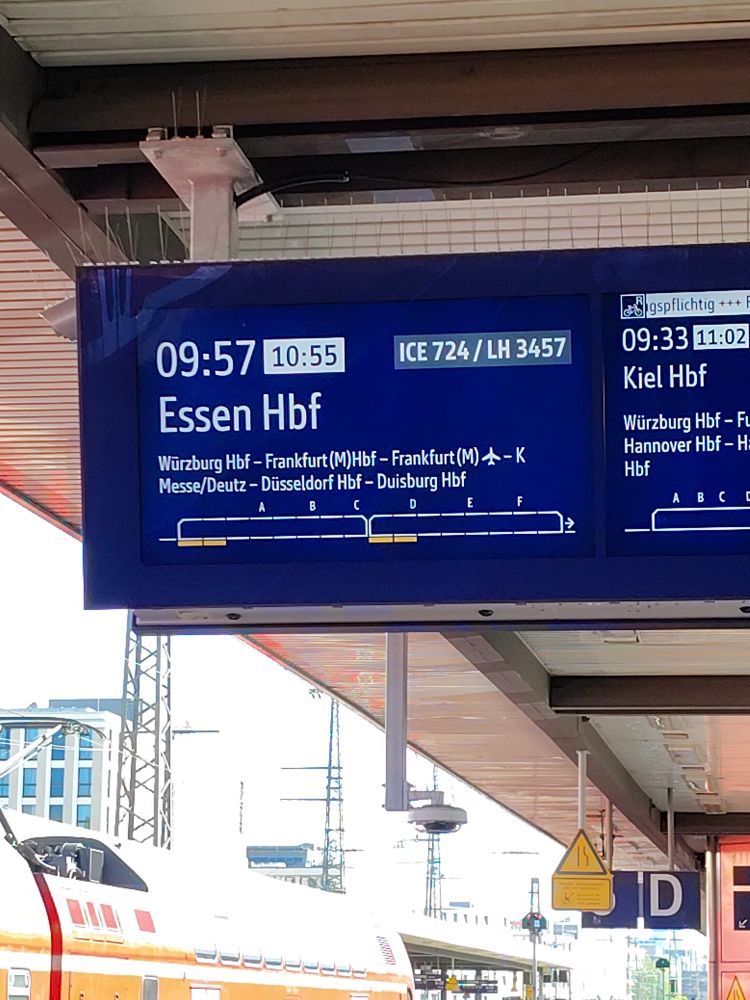 A train departure board showing a delay 