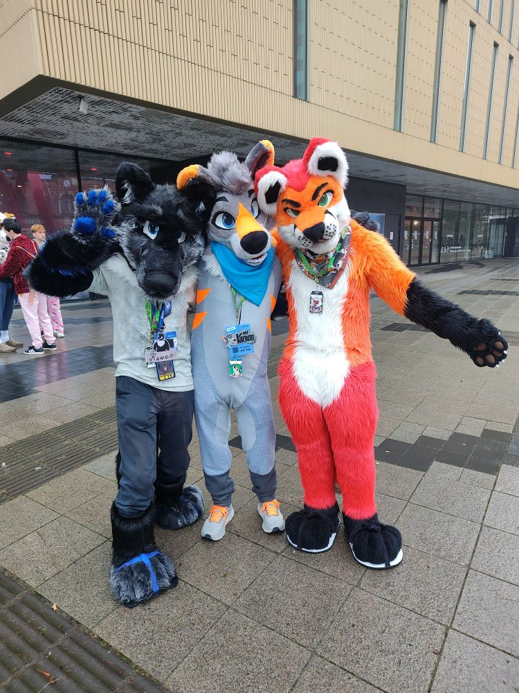 Trio of suiters posing in front of the NFC venue. From left to right, Rawen, Mt. Kanjon as Grout and Loimu