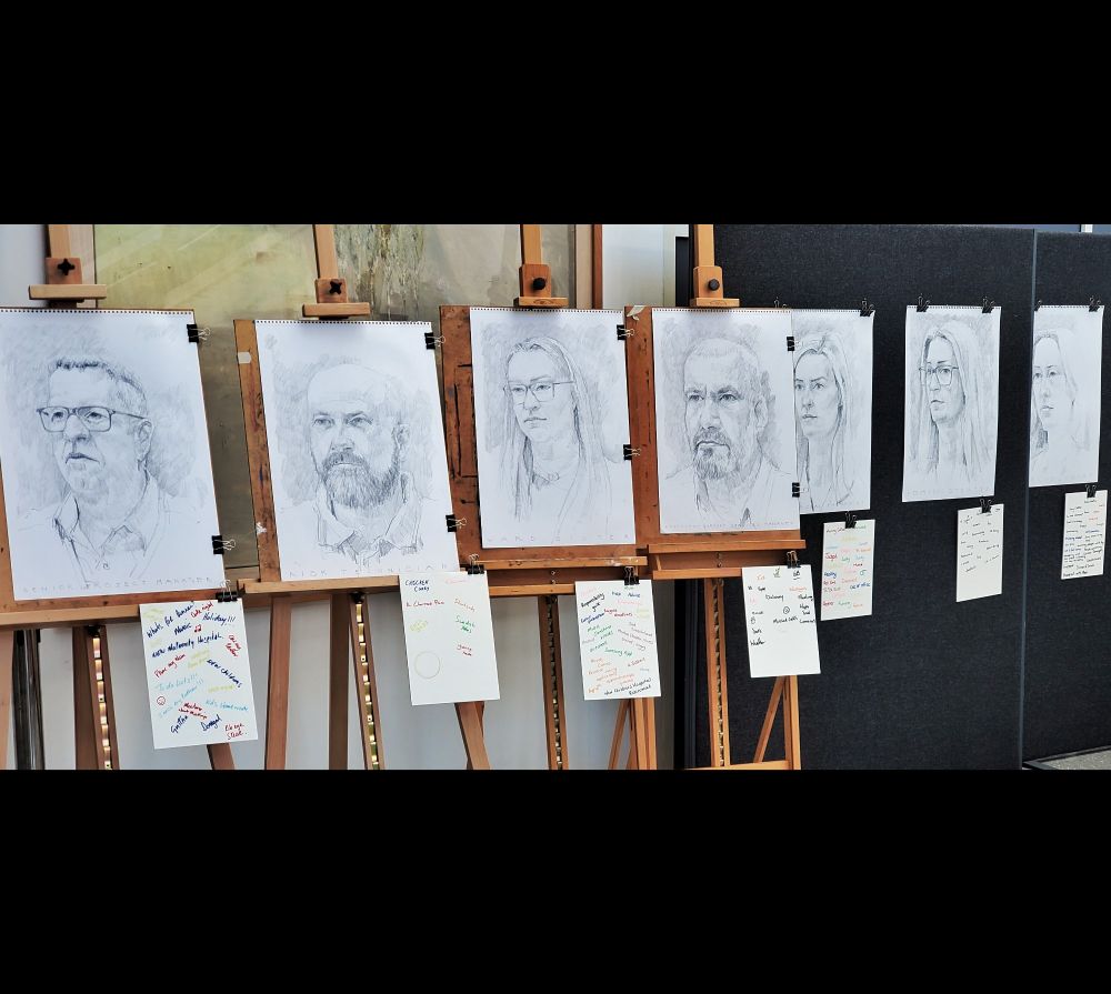 Series of pencil head drawings of men and women. Staff jot down what's going on in their heads as they sit for an hour being drawn. Head drawings and their notes are exhibited together.