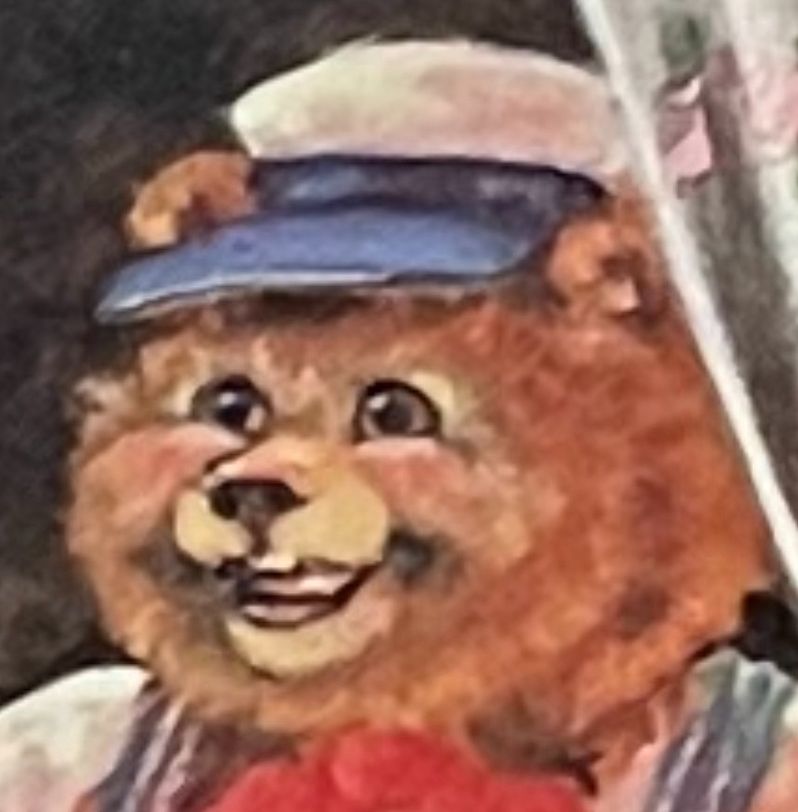 Goofy ol bear smiling with a twinkle in his eye