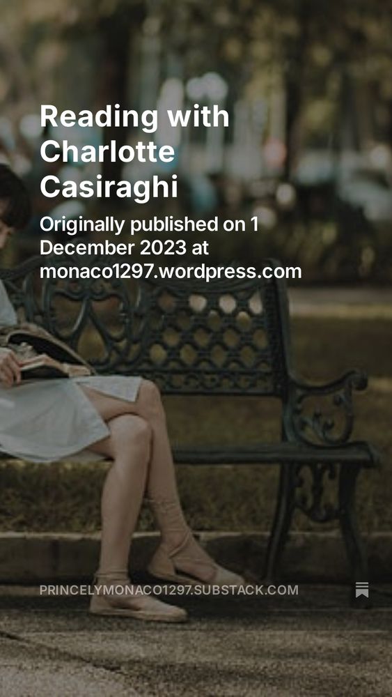 Woman sitting on a metal bench in a park reading a book 