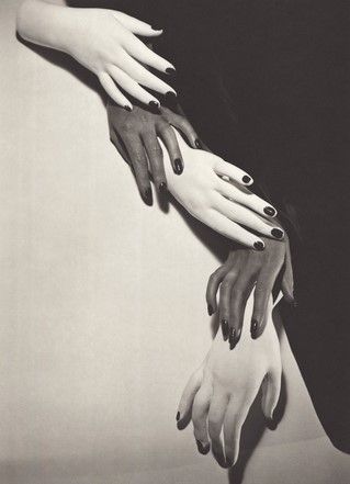 Composition of cascading (black) human and (white) mannequin nail-polished hands alternating against a black and white background.
