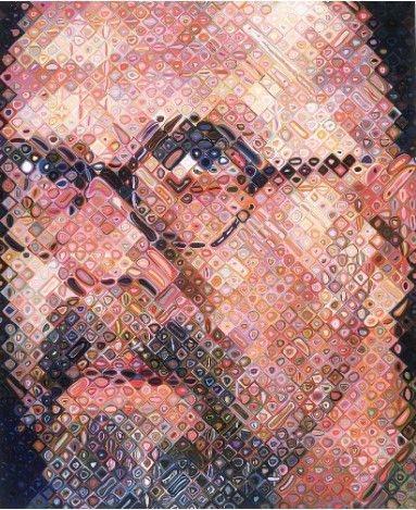 A colour pixellated close-up three-quarter profile portrait of a bald man with a goatee and wearing round-framed glasses.