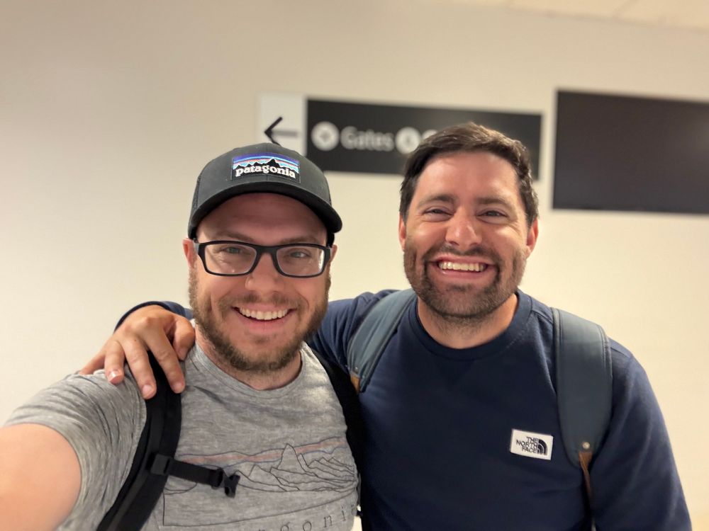 Two brothers in a selfie at the Seattle airport on an accidental overlapping layover